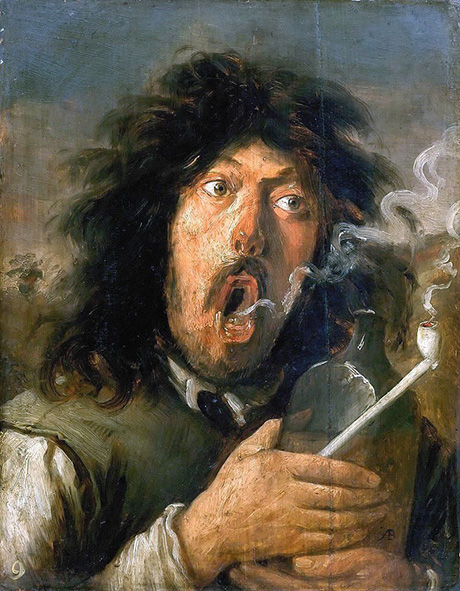 Homme fumant la pipe