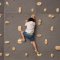 Child climbing a wall