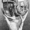 Reflection of a man in a spherical mirror held in his hand