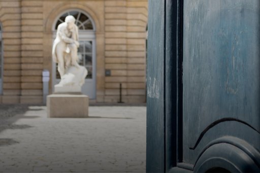 Portal opening onto the Budé courtyard and Champollion statue