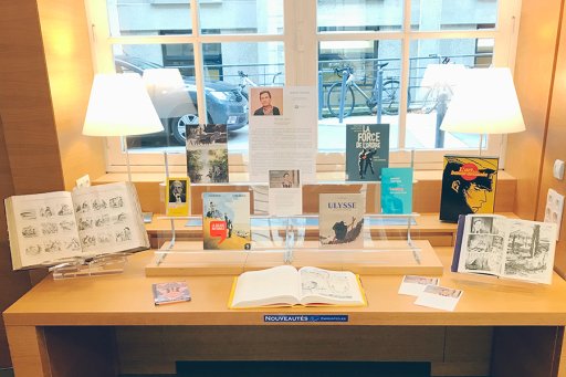 Photos of a table presenting Benoît Peeters' publications