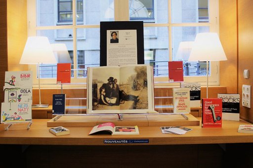 Photos of a table presenting Esther Duflo's selection of publications