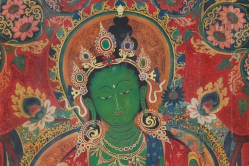 Traditional Tibetan painting (thangka) depicting a green-skinned Buddhist deity surrounded by richly colored floral and ornamental motifs.