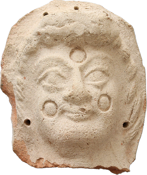 Tête de figurine en terre cuite
