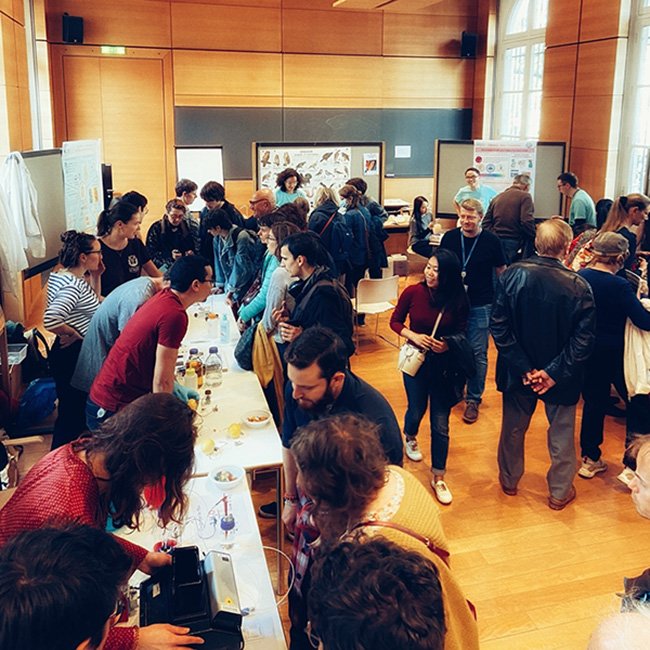 Chadocs demonstrate their experiments to visitors