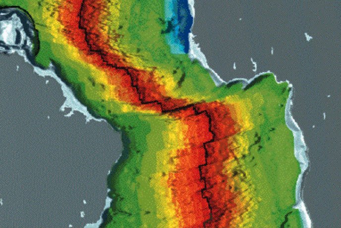 Carte en fausses couleurs montrant une zone centrale en rouge intense, bordée de jaune et de vert, avec une ligne noire sinueuse traversant la région