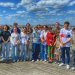 A group of middle and high school students on a guided tour of the Collège de France