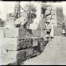 Black and white photograph by Étienne Drioton in Tod, next to an ancient Egyptian temple undergoing restoration